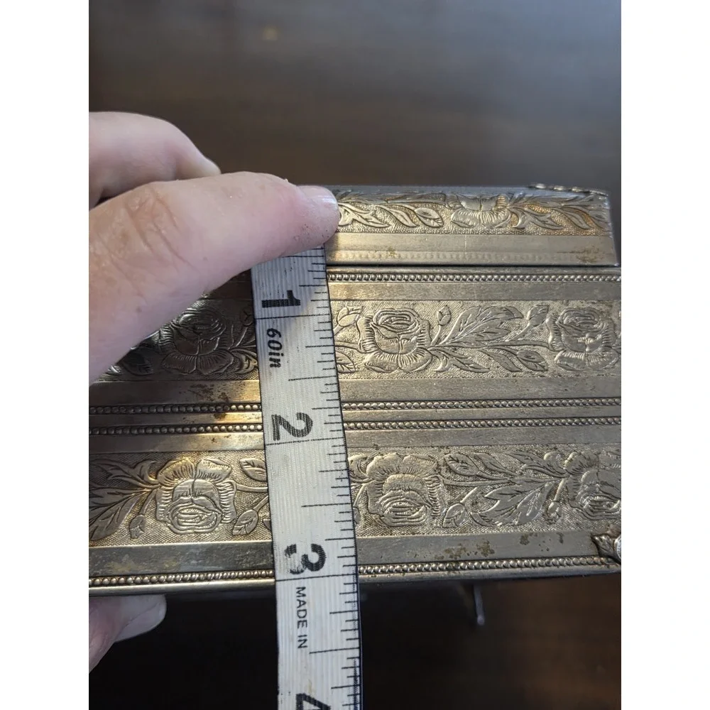 antique etched brass trinket box features a hinged lid Music Box